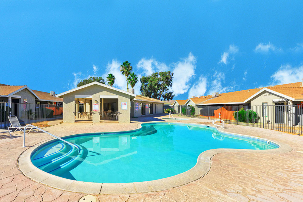 This image displays swimming pool photo of Quail Springs Village Apartments