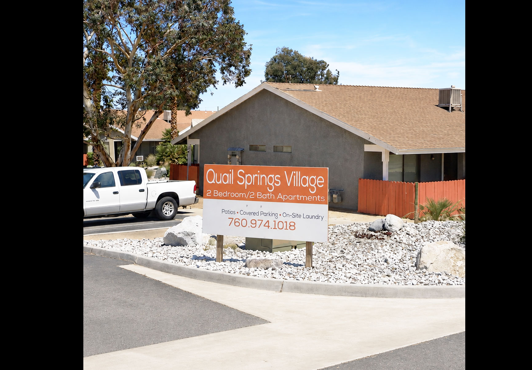 This image displays entrance marker photo of Quail Springs Village Joshua Trees