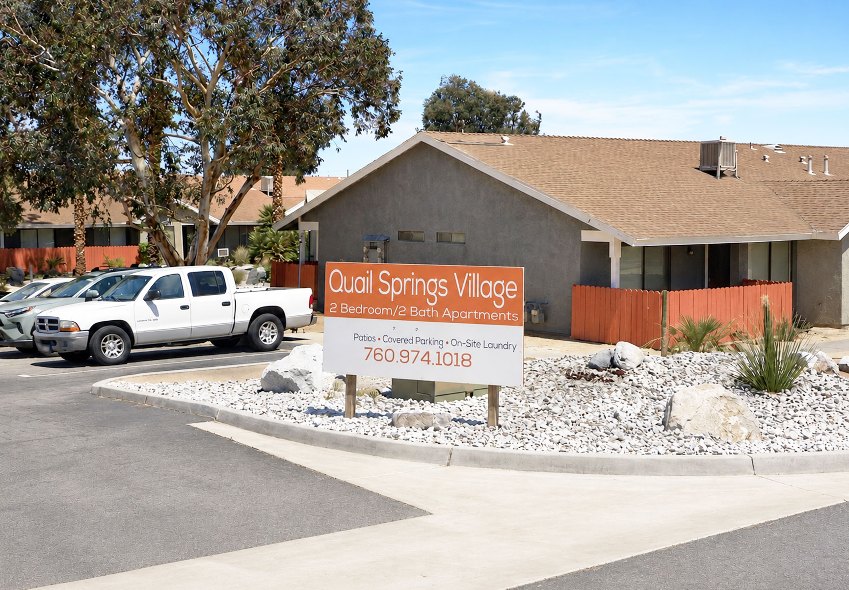 This image displays entrance marker photo of Quail Springs Village Joshua Trees